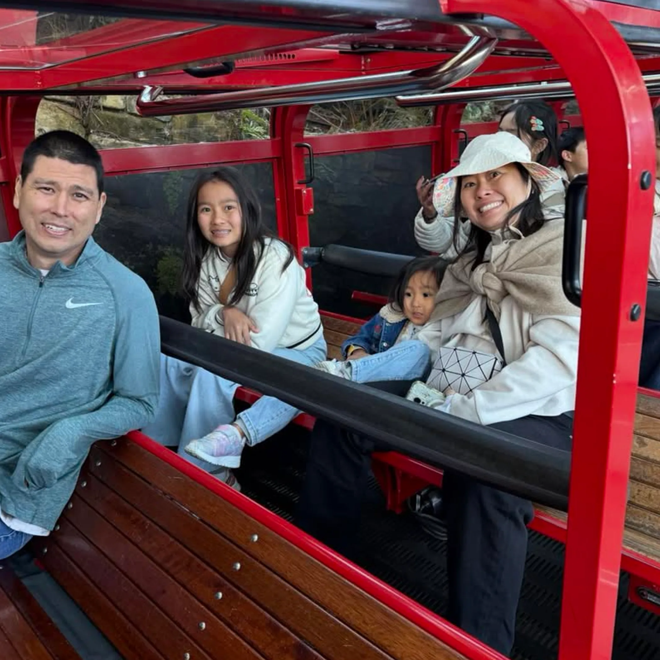 people riding scenic world railway train