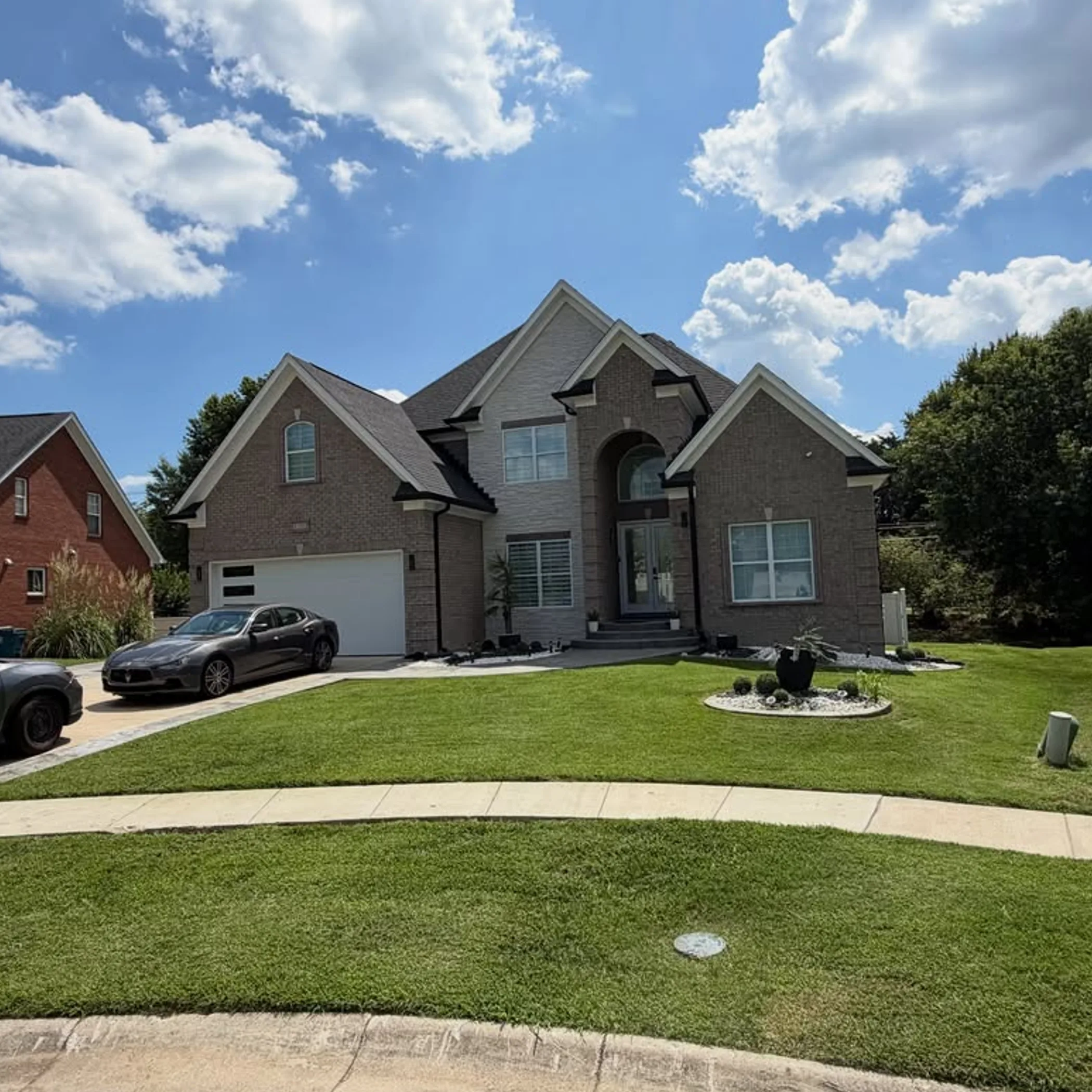 well-maintained lawn and landscaping