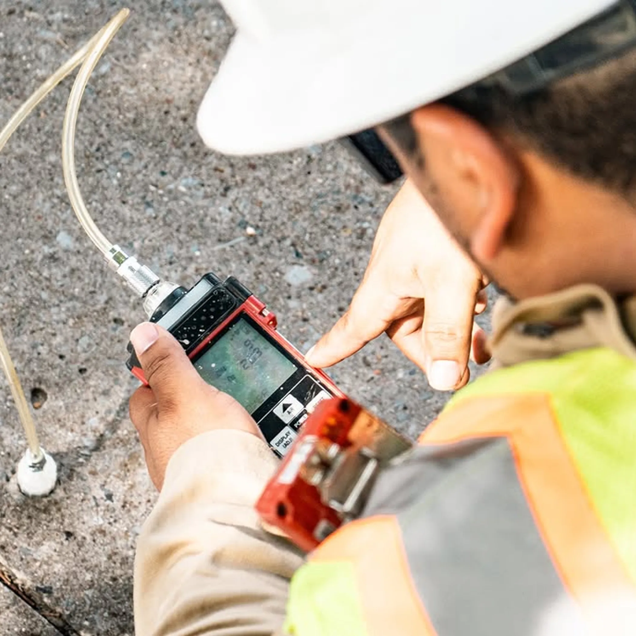 technician measuring soil gas concentrations